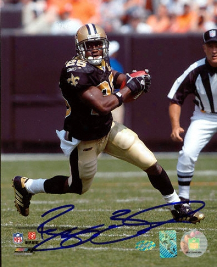 Reggie Bush New Orleans Saints - Cutting Up The Scene of military operations - Autographed 8x10 Photograph